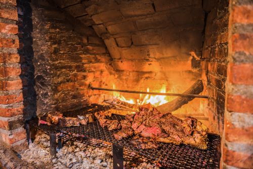 Argentina Travel Landscape Photography Asado Parrilla a traditional Argentinian barbeque at Estancia La Oriental Perito Moreno National Park Patagonia Argentina South America