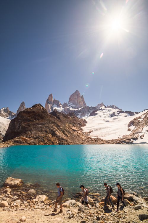 Argentina Travel Landscape Photography Hikers hiking at Lago de los Tres Mount Fitz Roy behind El Chalten Patagonia Argentina South America background with copy space