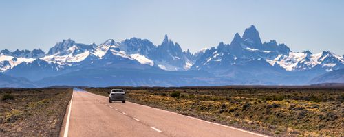 Argentina Travel Landscape Photography Long straight road to El Chalten with Mount Fitz Roy aka Cerro Chalten behind El Chalten Patagonia Argentina South America