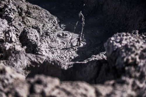 Bolivia Travel Landscape Photography Bubbling hot mud pool at Sol de Manana Geothermal Basin area Altiplano of Bolivia South America