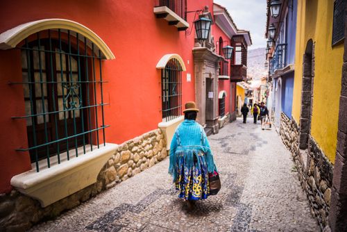 Bolivia Travel Landscape Photography Chollita on Calle Jaen a colourful colonial cobble street in La Paz La Paz Department Bolivia South America