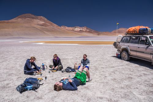 Bolivia Travel Landscape Photography Eating lunch at Laguna Hedionda a salt lake area in the Altiplano of Bolivia South America