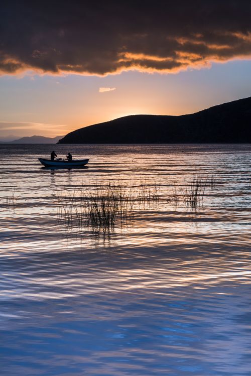 Bolivia Travel Landscape Photography Fishermen fishing at sunrise on Lake Titicaca Challapampa Isla del Sol Island of the Sun Bolivia South America