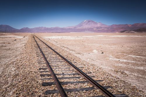 Bolivia Travel Landscape Photography Old train tracks used by mining industry to carry goods through Bolivian Altiplano from Bolivia to Chile South America