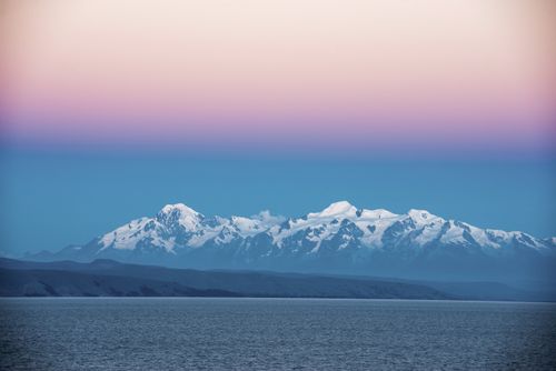 Bolivia Travel Landscape Photography Sunset Cordillera Real Mountain Range part of Andes Mountain Range and Lake Titicaca seen from Isla del Sol Bolivia South America