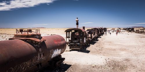 Bolivia Travel Landscape Photography Tourist at train Cemetery aka train graveyard Uyuni Bolivia South America