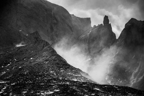 Chile Travel Landscape Photography Mountains in Torres del Paine National Park being battered by strong winds Patagonia Chile South America