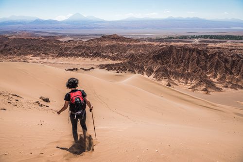 Chile Travel Landscape Photography Tourists in sand dunes at Death Valley Valle de la Muerte San Pedro de Atacama Atacama Desert North Chile South America