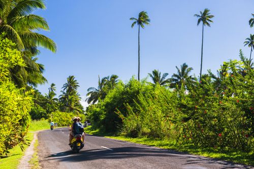 Cook Islands Landscape Travel Photography Moped driving on the circular road around Rarotonga Cook Islands