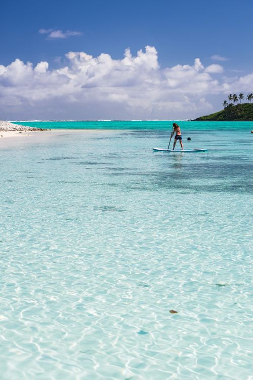 Cook Islands Landscape Travel Photography Paddleboarding in Muri Lagoon Rarotonga Cook Islands background with copy space