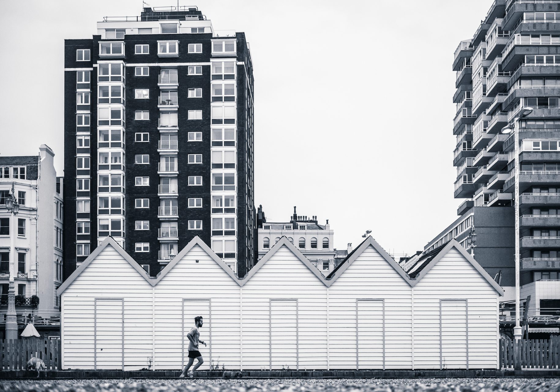England Travel Photography Jogging on Brighton Beach Brighton and Hove East Sussex England