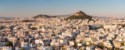 Greece Travel Photography View of Athens and Likavitos Hill over the rooftops of the Plaka District from The Acropolis Attica Region Greece