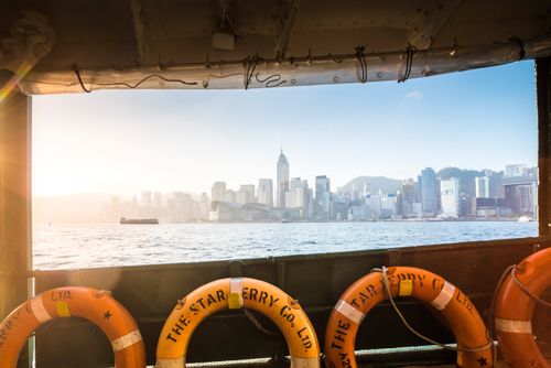 Hong Kong Travel Photography Star Ferry at sunrise with Hong Kong Island behind Hong Kong China
