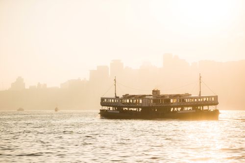 Hong Kong Travel Photography Star Ferry at sunset between Hong Kong Island and Kowloon Hong Kong China