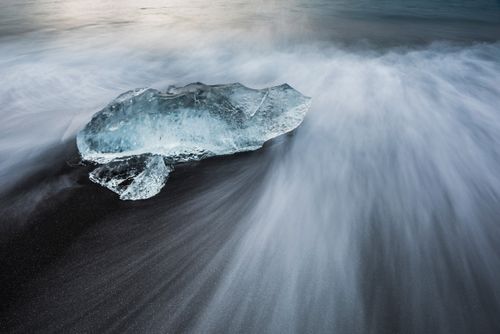 Iceland Landscape Photography Iceberg at sunrise on Jokulsarlon Beach a black volcanic sand beach in South East Iceland 3