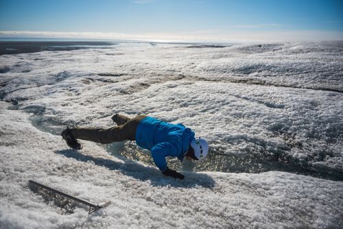 Iceland Travel Photography Drinking glacial water on while on a glacier hike on Breidamerkurjokull Glacier Vatnajokull Ice Cap Iceland Europe