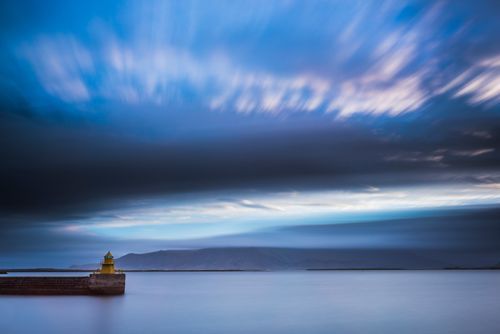 Iceland Travel Photography Lighthouse in Reykjavik Harbour at sunrise Iceland