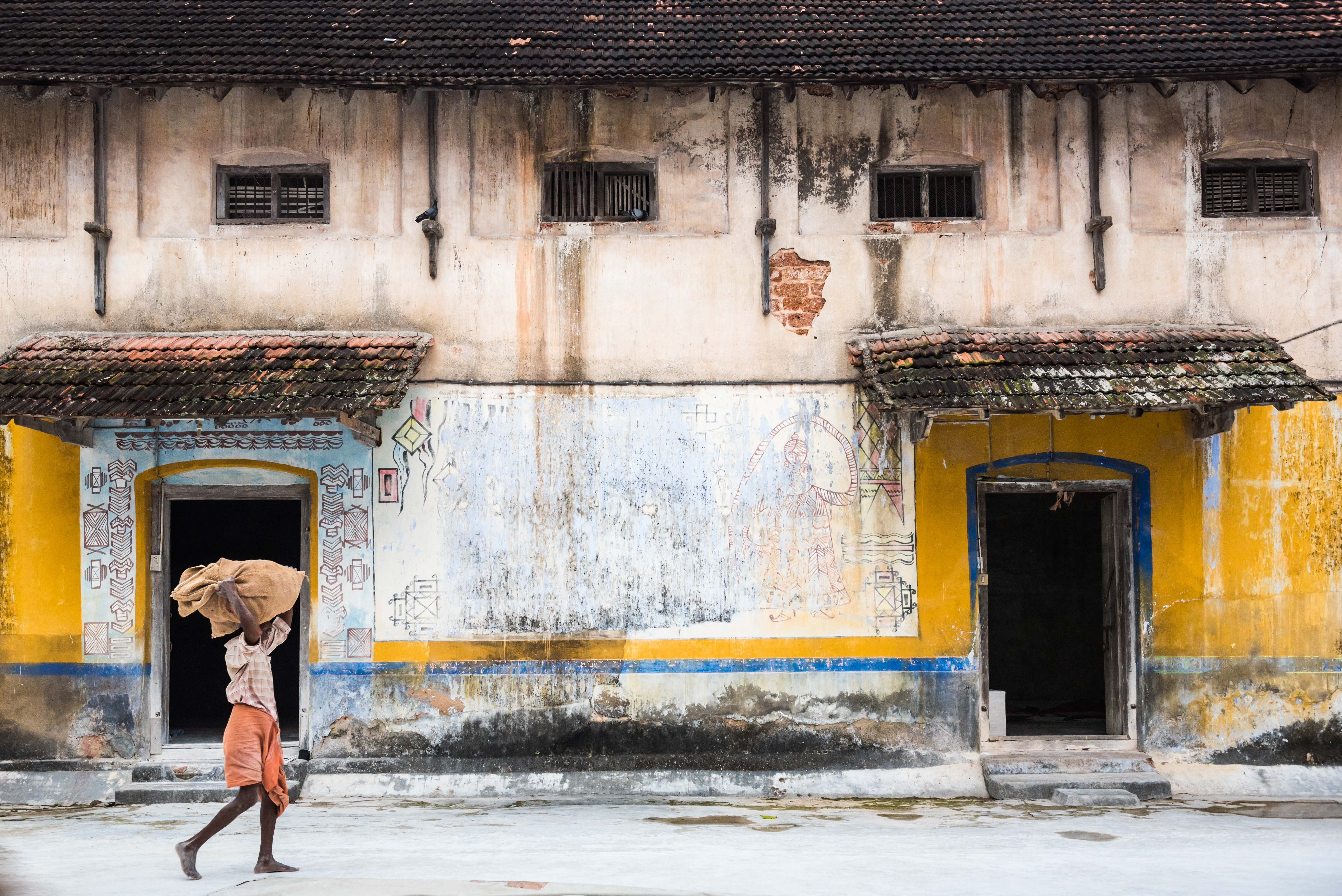 India Travel Street Photography Sorting ginger at a market in Fort Kochi Cochin Kerala India