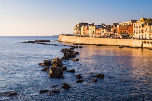 Italy Sicily Travel Photography Colourful Sicilian houses on Ortigia Island at sunrise Syracuse Siracusa Sicily Italy Europe