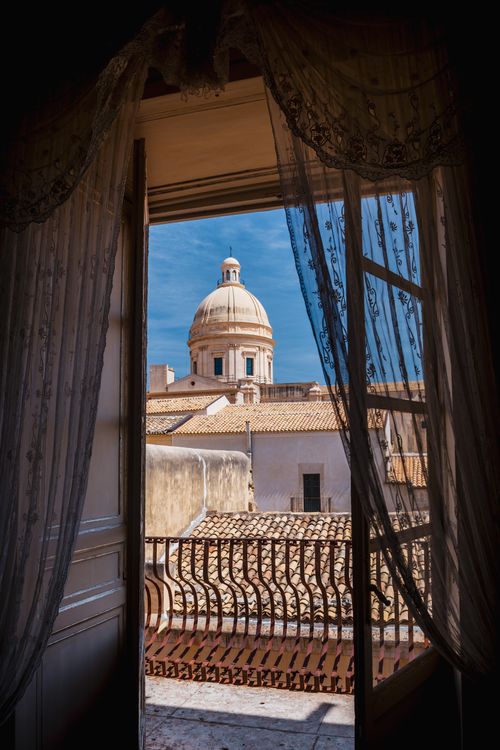 Italy Sicily Travel Photography Dome of Noto Cathedral seen from Palazzo Nicolaci di Villadorata Nicolaci Palace Noto Val di Noto UNESCO World Heritage Site Sicily Italy Europe