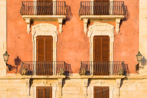 Italy Sicily Travel Photography Ortigia architectural detail of typical Sicilian balconies and shutters Syracuse Siracusa Sicily Italy Europe