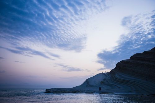 Italy Sicily Travel Photography Scala dei Turchi clouds reflecting the shape of The Turkish Staircase at sunset Rossello cape Realmonte Agrigento Sicily Italy Europe