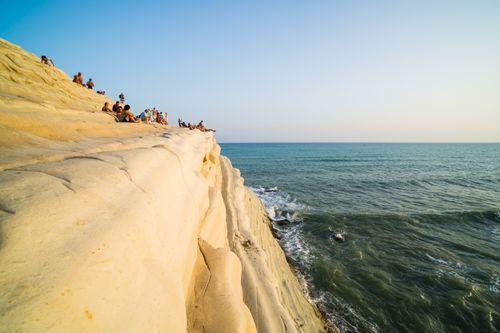 Italy Sicily Travel Photography Scala dei Turchi tourists watching the sun set Rossello cape Realmonte Agrigento Sicily Italy Europe