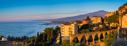 Italy Sicily Travel Photography Sunrise hitting the top of Mount Etna Volcano Taormina East Coast of Sicily Ionian Sea Mediterranean Sea Italy Europe