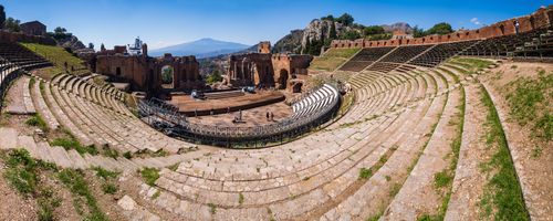 Italy Sicily Travel Photography Taormina Mount Etna Volcano seen from Teatro Greco aka Taormina Amphitheatre or Roman and Greek Amphitheatre Sicily Italy Europe