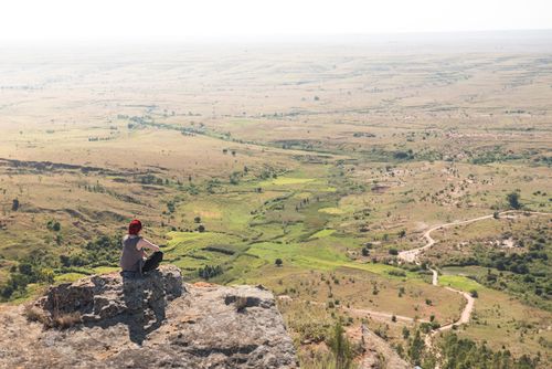 Madagascar Adventure Travel Photography Tourist in Isalo National Park looking over Ihorombe Plains Southwest Madagascar