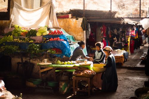 Madagascar Documentary Travel Photography Street scene in Antisrabe Market at sunset Vakinankaratra Region Madagascar Central Highlands