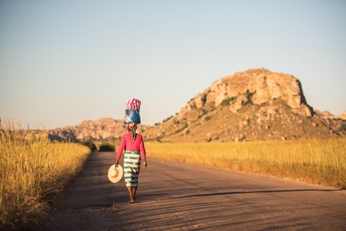 Madagascar Travel Photography Local Madagascan Woman balancing goods on her head Isalo National Park Southwest Madagascar