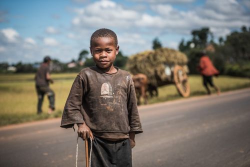Madagascar Travel Portraiture Portrait Photography Portrait of a boy on RN7 Route Nationale 7 near Ambatolampy in the Central Highlands of Madagascar