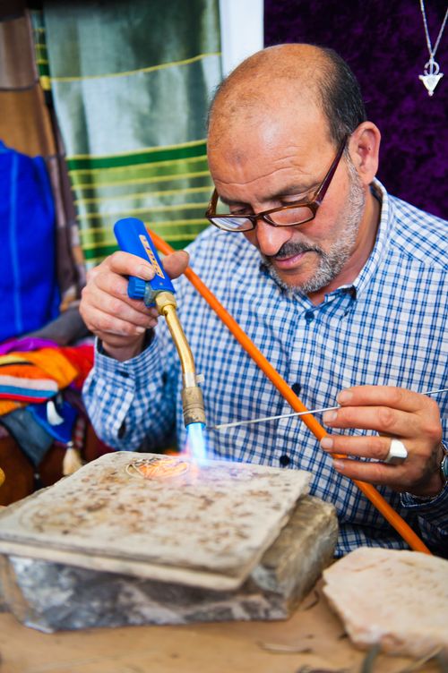 Morocco Travel Portrait Photography Portrait of a jewelry maker carrying out filigree work Essaouira formerly Mogador UNESCO World Heritage Site Morocco Africa