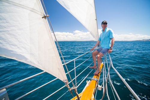 New Zealand Travel Photography Tourist on a sailing boat trip in the Bay of Islands from Russell Northland Region North Island New Zealand