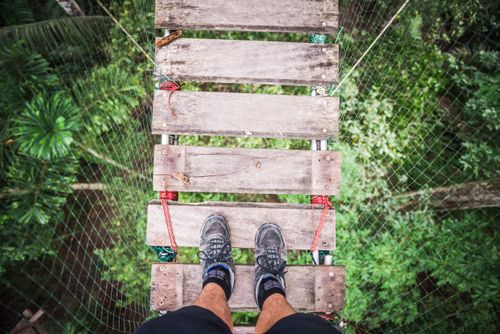 Peru Travel Photography Amazon Jungle swinging rope bridge in Puerto Maldonado area of Peru South America