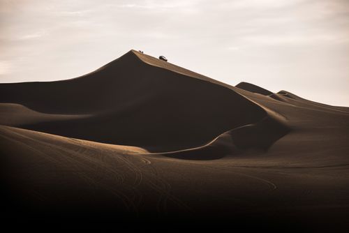 Peru Travel Photography Dune buggying on sand dunes in the desert at Huacachina Ica Region Peru South America