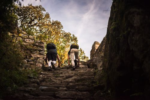 Peru Travel Photography End of Inca Trail Trek on final mornings climb to Machu Picchu Cusco Region Peru South America