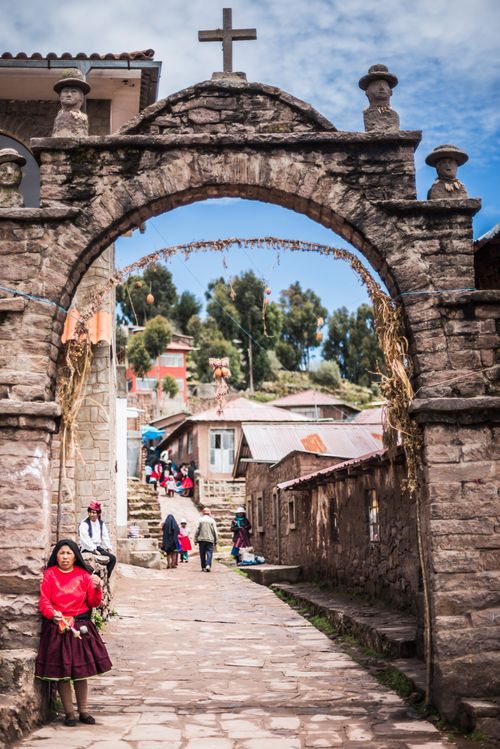 Peru Travel Photography Peruvian Quechua Woman winding wool on Taquile Island Lake Titicaca Peru South America