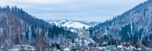 Romania Landscape Travel Photography Bran Castle covered in snow in winter Transylvania Romania 3
