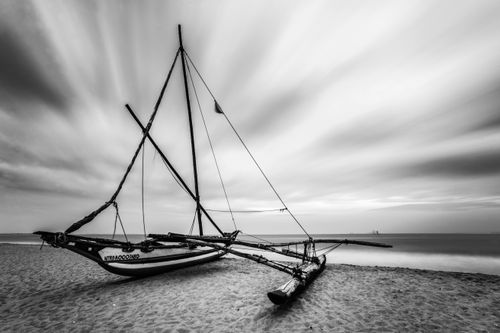 Sri Lanka Travel Photography Outrigger fishing boat on Negombo Beach at sunrise Sri Lanka Asia