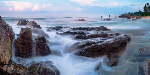 Sri Lanka Travel Photography Stilt fishermen at Midigama Beach at sunrise near Weligama South Coast Sri Lanka Asia