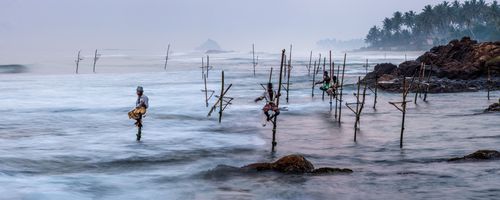 Sri Lanka Travel Photography Stilt fishermen at Midigama Beach near Weligama South Coast Sri Lanka Asia