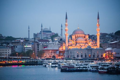 Turkey Architecture Travel Photography New Mosque Yeni Cami at night with Hagia Sophia Aya Sofya behind seen across the Golden Horn Istanbul Turkey Eastern Europe