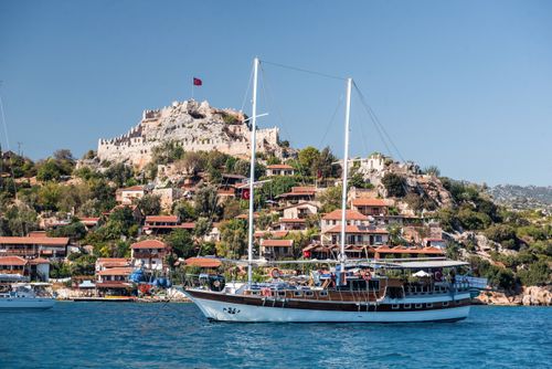 Turkey Travel Photography Simena Castle and Gulet sailing boat seen from Kekova Bay Antalya Province Lycia Anatolia Mediterranean Sea Turkey Eastern Europe