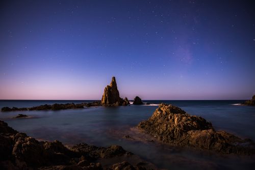 Landscape Photography by Professional Freelance UK Landscape Photographer Arrecife de Las Sirenas under stars at night Cabo de Gata Nijar Natural Park Andalucia Almeria Spain Europe background with copy space