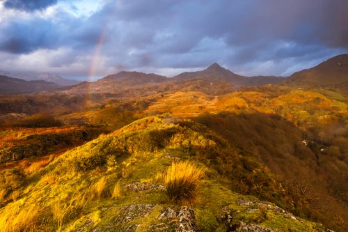 Landscape Photography by Professional Freelance UK Landscape Photographer Cnicht under a rainbow at sunset Snowdonia National Park North Wales