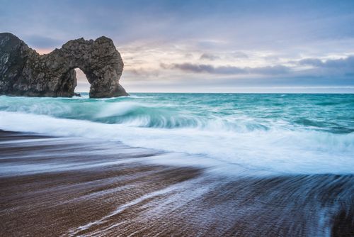 Landscape Photography by Professional Freelance UK Landscape Photographer Durdle Door at sunrise Lulworth Cove Jurassic Coast Dorset England