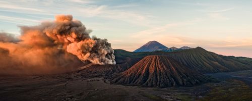 Landscape Photography by Professional Freelance UK Landscape Photographer Extremely Active Mount Bromo Throwing up Ash Clouds at sunrise with Mount Sumeru Gunug Bromo Indonesia Asia