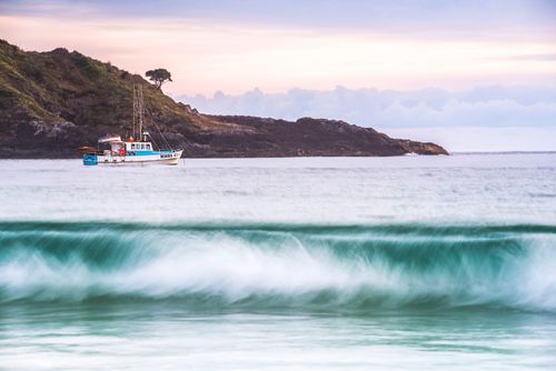 Landscape Photography by Professional Freelance UK Landscape Photographer Fishing baot in Maitai Bay aka Matai Bay Beach on the Karikari Peninsula Northland New Zealand